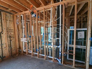 Interior mechanical and plumbing work during reconstruction