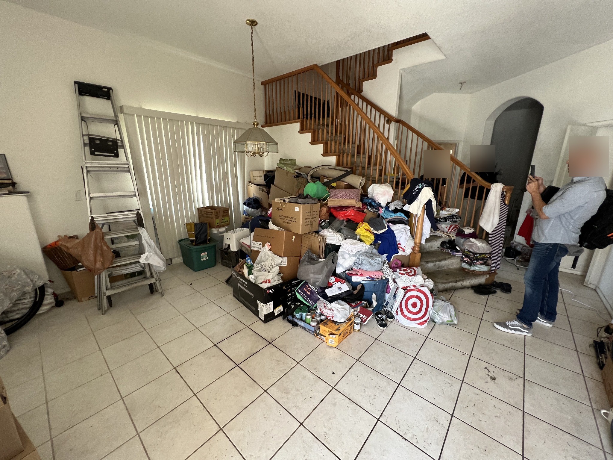 Gay Street living area before rehabilitation; faces anonymized