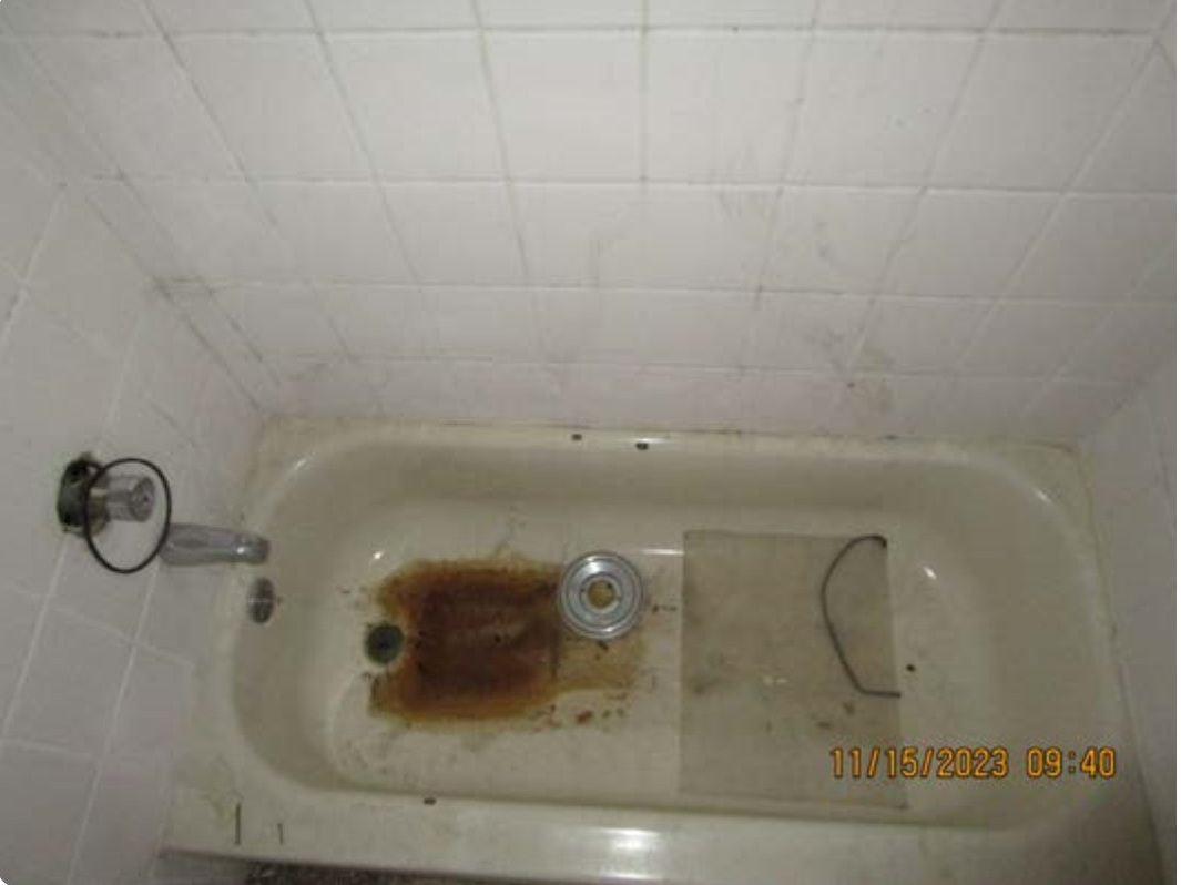 Tyler Avenue unsanitary bathroom before receivership rehabilitation